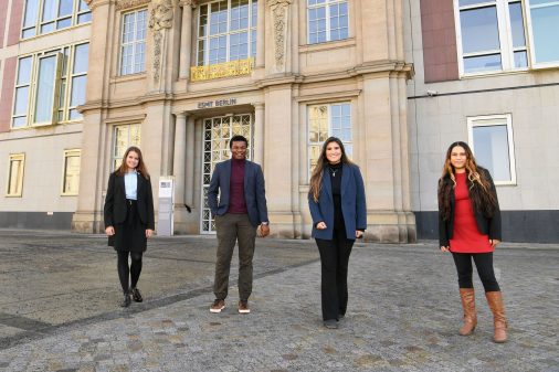 4 MIM students standing in front of ESMT building 