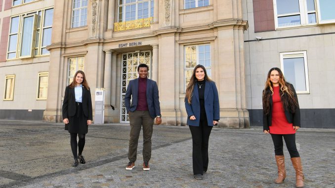 4 MIM students staning outside ESMT Building