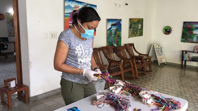 Woman making pulseras