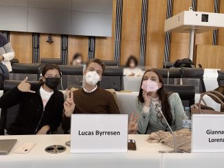 3 students wearing face masks in class