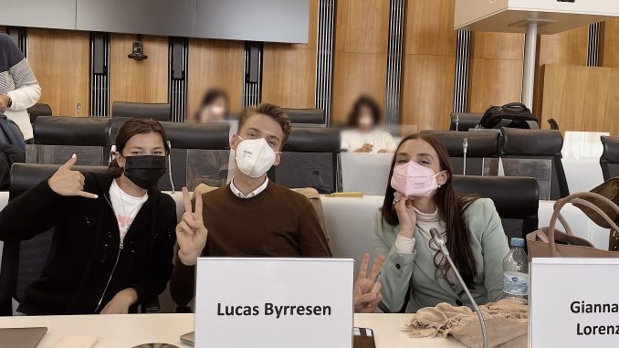 3 students wearing face masks in class