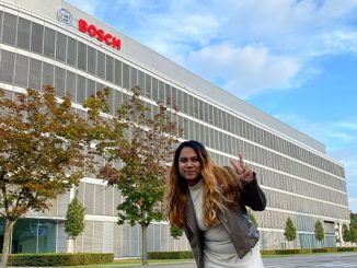 student posing in front of Bosch building