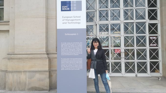 Asian female standing in front of ESMT Berlin building