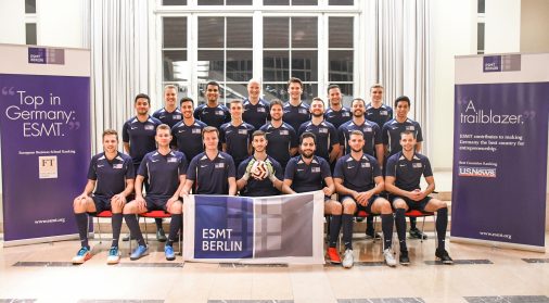 Football team group photo with ESMT Berlin flag