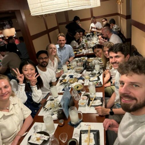 A group photo of PTMBA students during dinner in Tokyo